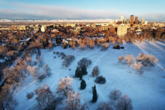 Snow continues in mountains, cold, windy in Denver