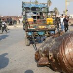 Statues Of Bashar Al-Assad's Father Dragged Through Syria Roads