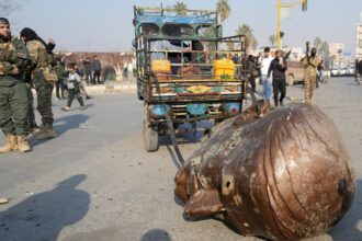 Statues Of Bashar Al-Assad's Father Dragged Through Syria Roads