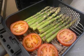 Two layers of vegetables ready to go into the air fryer