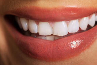 Close up on woman white teeth.