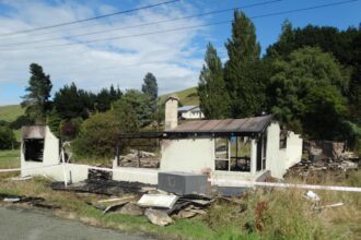 Empty house goes up in flames