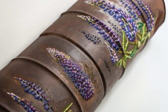 Flowers and Butterflies Stitch Messages of Hope into Crumpled Metal and Corroded Barrels — Colossal