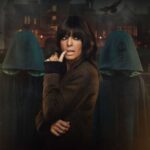 Claudia Winkleman and two Traitors in cloaks