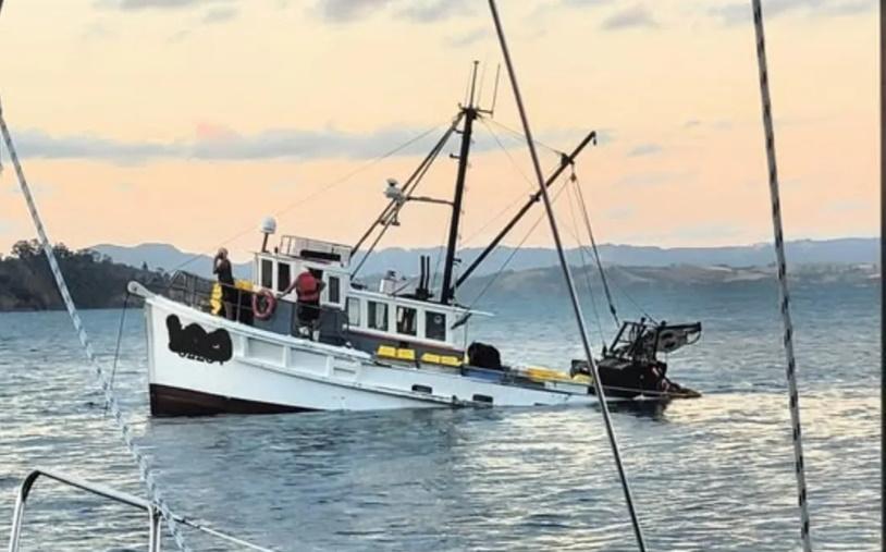 Two rescued as fishing boat sinks