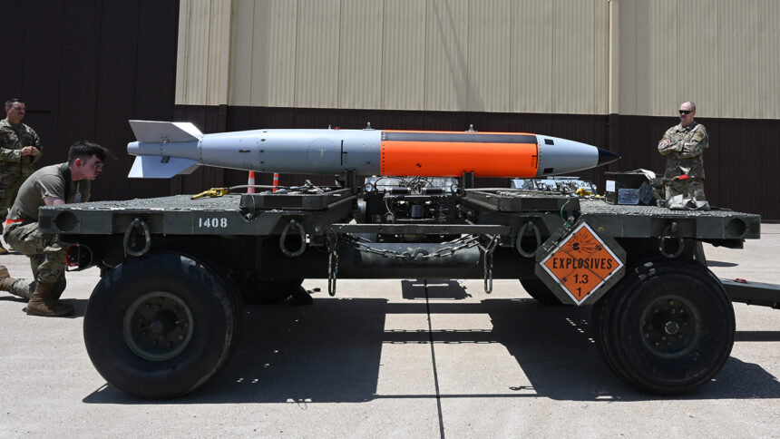 Military personnel are shown with a nuclear-capable weapons system during a test.