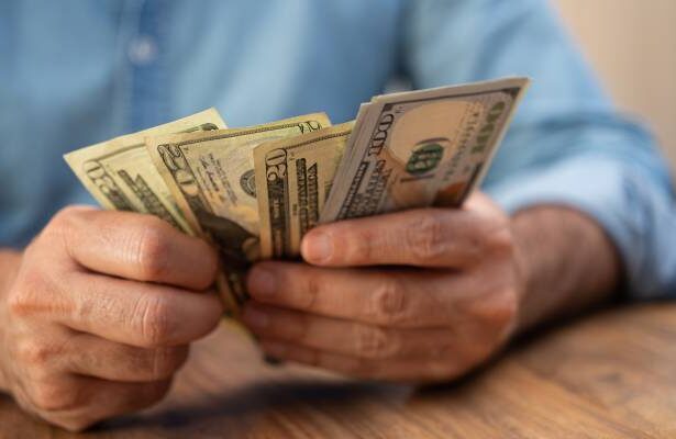 I just inherited K — should I use it to pay off my K credit card debt or keep it for my emergency fund?