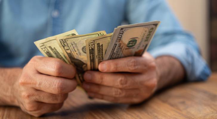 I just inherited K — should I use it to pay off my K credit card debt or keep it for my emergency fund?