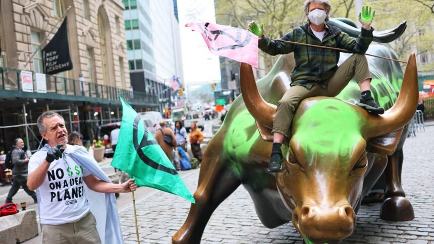 Wall Street’s iconic charging bull statue vandalized by climate activists