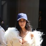 Kim Kardashian Pushes High-Low Dressing to the Extreme in Ostrich Feathers and a Baseball Cap