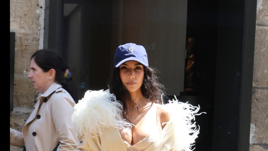 Kim Kardashian Pushes High-Low Dressing to the Extreme in Ostrich Feathers and a Baseball Cap