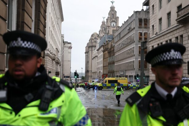 Car plows into Liverpool FC Premier League parade, injuring fans : NPR