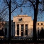 Federal Reserve holds rates steady as it warns of rising economic risks