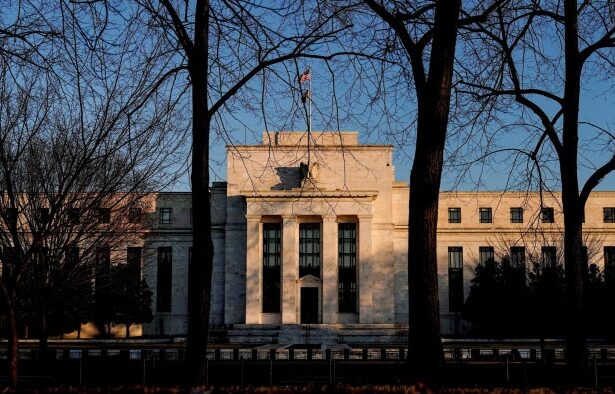 Federal Reserve holds rates steady as it warns of rising economic risks