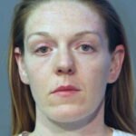 Former cop pleads guilty to killing husband in gun struggle