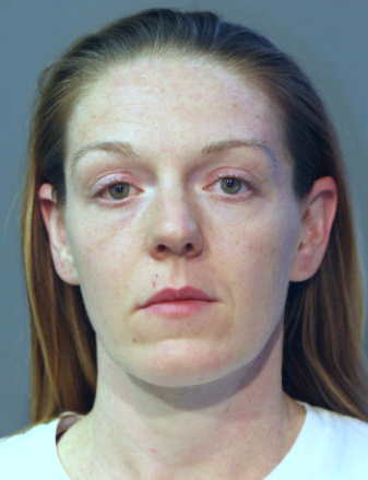 Former cop pleads guilty to killing husband in gun struggle
