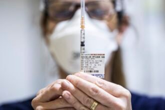 Gaza aid distribution; COVID vaccine guidelines : NPR