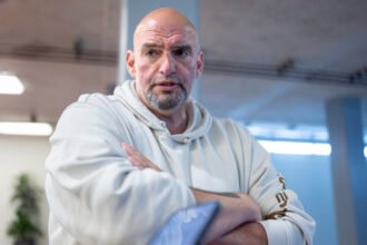 John Fetterman finds himself increasingly alone