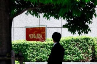 Nomura hails progress in weaning staff off smoking