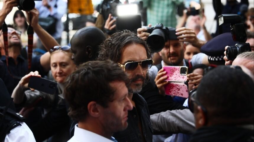 Russell Brand Arrives at London Court for Rape Charge Hearing