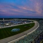 Which NASCAR driver and team has the most wins in the AdventHealth 400 at Kansas?