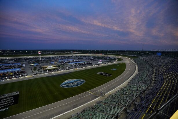 Which NASCAR driver and team has the most wins in the AdventHealth 400 at Kansas?