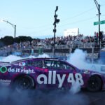 By how much did the inaugural NASCAR Chicago Street race overshoot the ,000,000 budget?