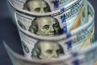 Dollar sinks to three-year low on Trump tariff threat