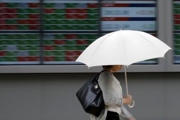 Shares advance, oil prices settle sharply lower as markets shrug off Iran conflict