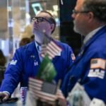 Stock trading surge helps Wall Street navigate dealmaking trough