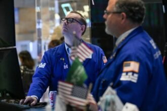 Stock trading surge helps Wall Street navigate dealmaking trough