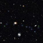 Weird line of galaxies may have been created by a cosmic bullet
