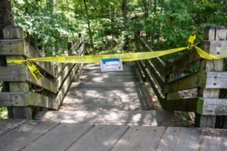 Arkansas teacher charged with killing couple who were hiking with their kids