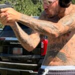 Justin Bieber Shooting Guns Shirtless