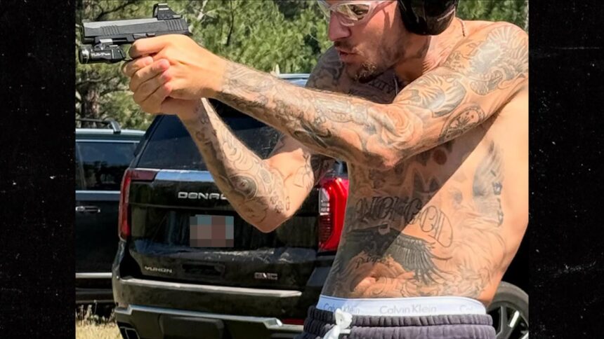 Justin Bieber Shooting Guns Shirtless