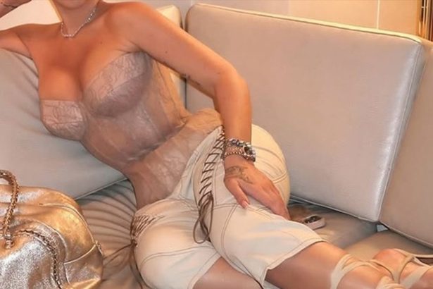 Guess The Sexy Singer Tied Up In This Corset!