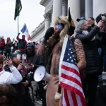 'QAnon Shaman' Files Insane  Trillion Lawsuit Against Donald Trump and the Federal Reserve, Declares Himself Leader of a 'New Constitutional Republic'