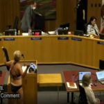 Woman disrobes at California school board meeting in protest of locker room policies