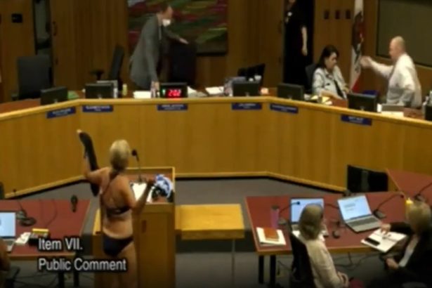 Woman disrobes at California school board meeting in protest of locker room policies