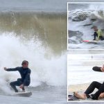 Thrill-seeking surfers flock to NYC for gnarly 10-foot nor’easter waves: ‘Floating between mountains’