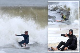 Thrill-seeking surfers flock to NYC for gnarly 10-foot nor’easter waves: ‘Floating between mountains’