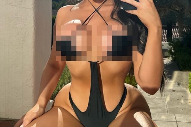 Guess the Sexy Star Sportin’ This Black Cut-Out Swimsut!