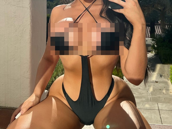 Guess the Sexy Star Sportin’ This Black Cut-Out Swimsut!