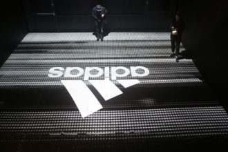 Adidas North America sales hit by weak dollar, CEO says tariff impact still unclear