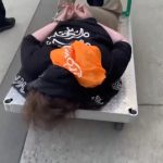 ICE posts viral video of cuffed Portland protester being wheeled away on flatbed cart