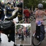 Naked protesters cycle through Portland in protest against federal troops