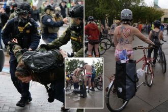 Naked protesters cycle through Portland in protest against federal troops