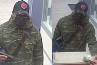 FBI seeks man who displayed gun during suburban bank robbery