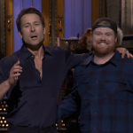 Glen Powell Brings His UPS Driver to Crash ‘SNL’ Monologue