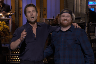 Glen Powell Brings His UPS Driver to Crash ‘SNL’ Monologue